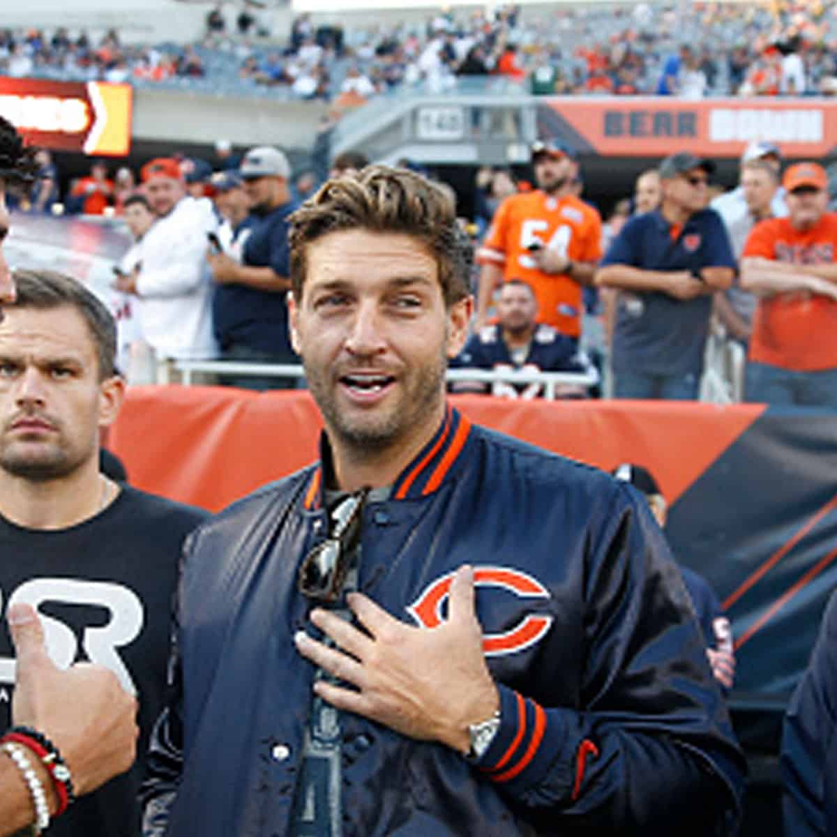 Jay Cutler stands on the field with former teammate Zach Miller, left, prior to the game between the Chicago Bears and the Green Bay Packers