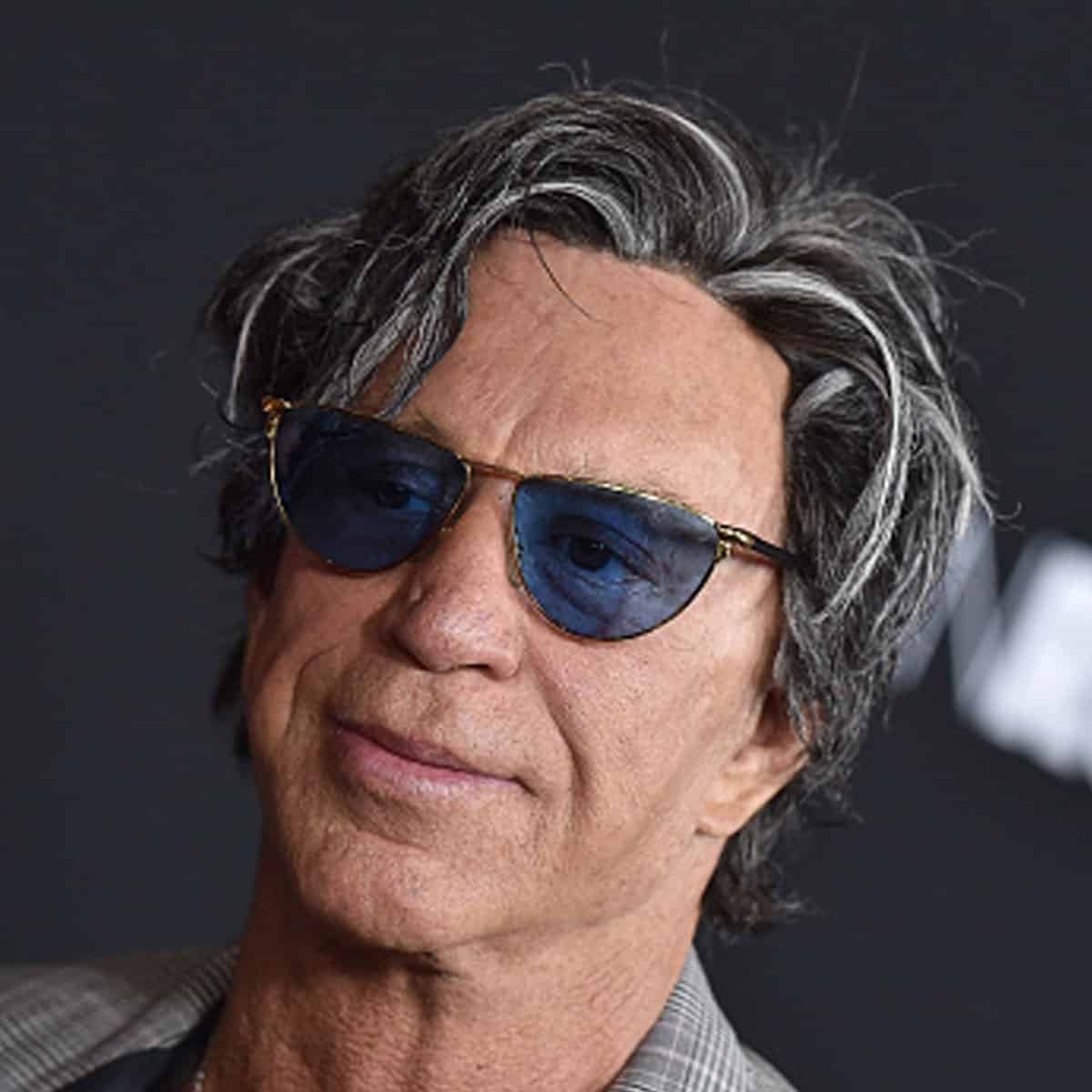 Mickey Rourke arrives at the premiere of Open Road's 'Triple 9' at Regal Cinemas L.A.